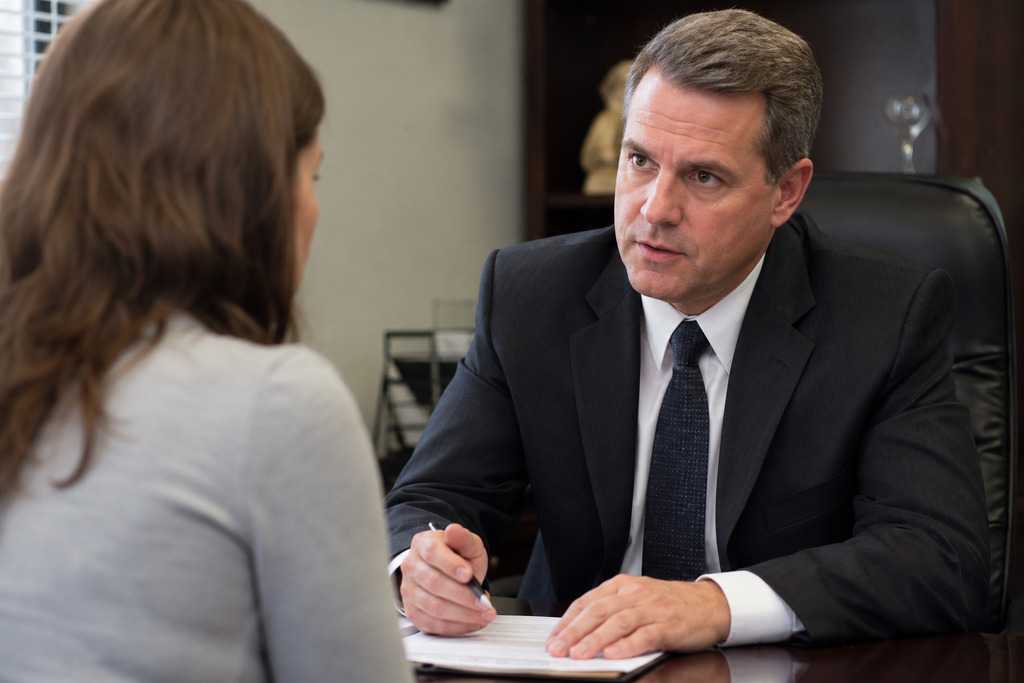 Bail Bonds Expert Talking To Client