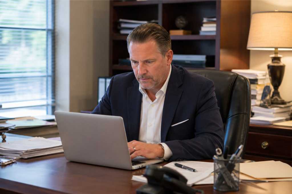 Bail Bondsman Reviewing Client Records